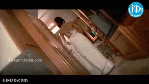 Woman In White Dress Near Dream Media Logo GIF