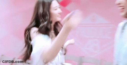 Woman In White Dress Next To Man In Pink Shirt GIF
