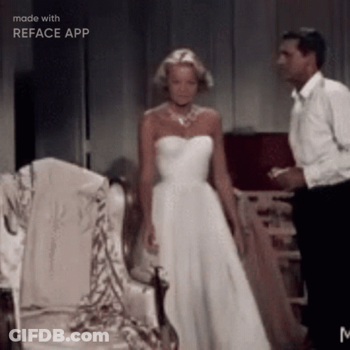Woman In White Dress Next To Man In Tuxedo GIF