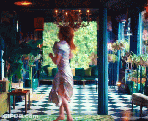 Woman In White Dress On Checkered Floor GIF