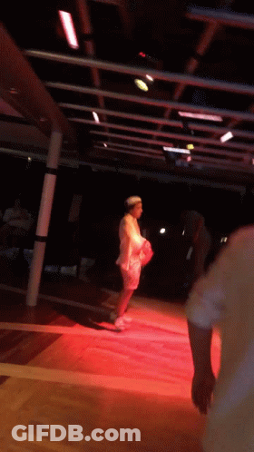 Woman In White Dress On Red Stage GIF