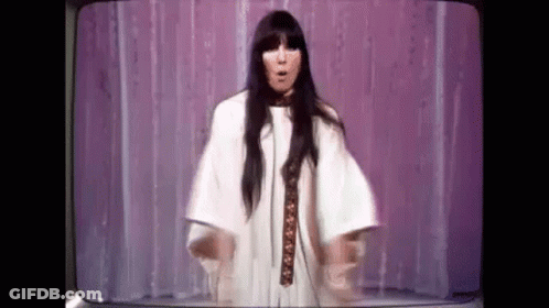 Woman In White Dress On Stage With Television GIF