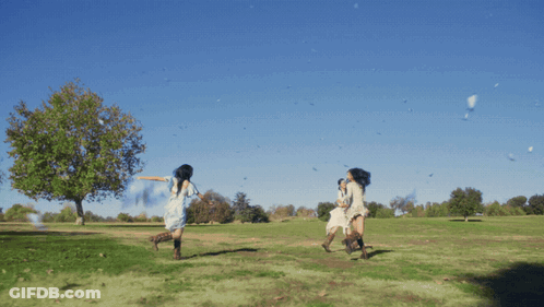 Woman In White Dress Running In Field GIF