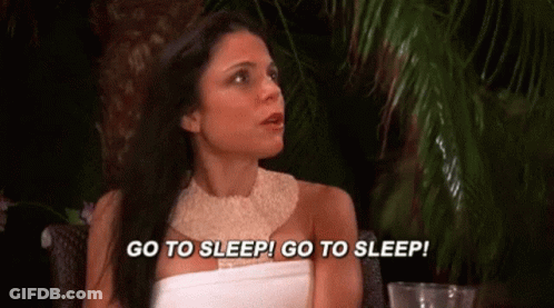 Woman In White Dress Saying Go To Sleep GIF