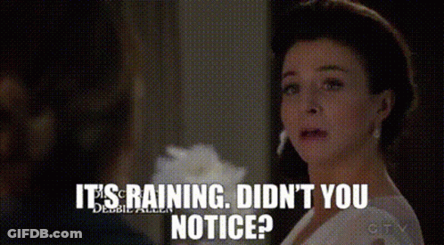 Woman In White Dress Saying It's Raining GIF