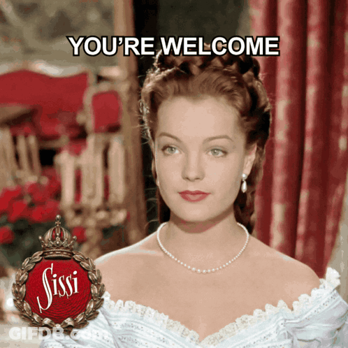 Woman In White Dress Saying Youre Welcome GIF