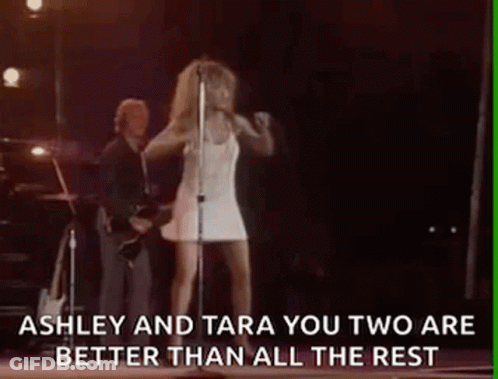 Woman In White Dress Singing Into Microphone GIF
