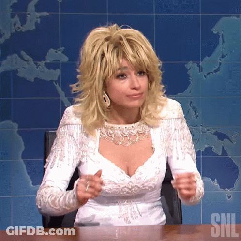 Woman In White Dress Sitting At Desk SNL GIF