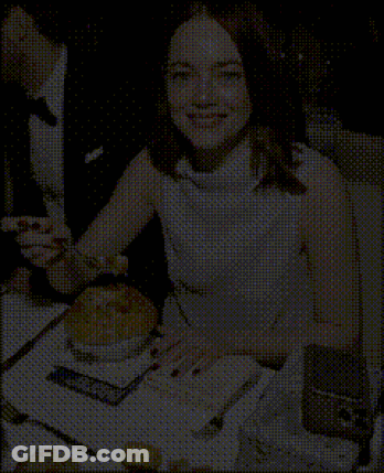 Woman In White Dress Sitting At Table With Plate Of Food GIF