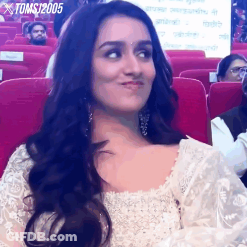 Woman In White Dress Sitting In Red Seats Toms 2005 GIF