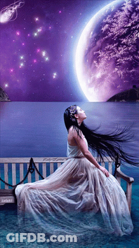 Woman In White Dress Sitting On Bench Overlooking Ocean GIF