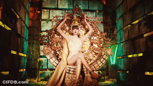 Woman In White Dress Sitting On Throne With Crossed Legs GIF
