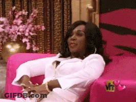 Woman In White Dress Sitting Pink Chair GIF
