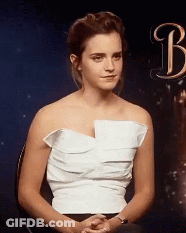 Woman In White Dress Sitting With Hands Folded GIF