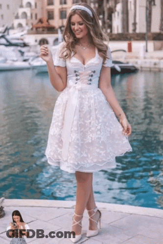 Woman In White Dress Standing By Water GIF