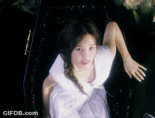 Woman In White Dress Standing In Black Coffin GIF