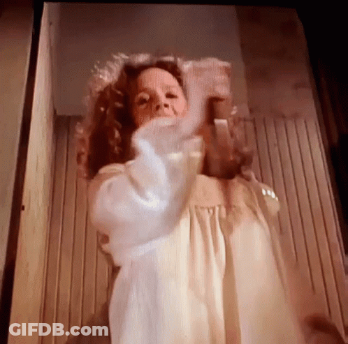 Woman In White Dress Standing In Front Of Door GIF