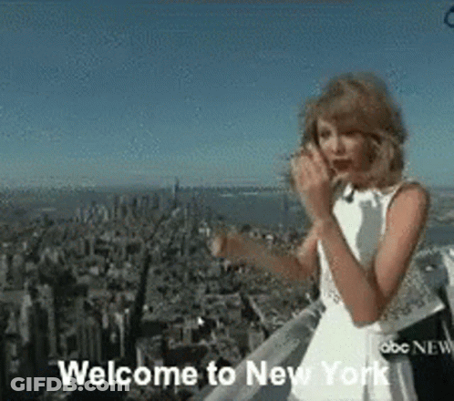 Woman In White Dress Standing On Building GIF