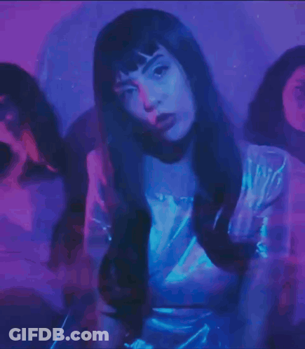Woman In White Dress Surrounded By Blue Light GIF
