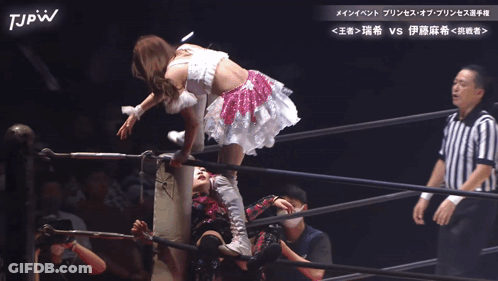 Woman In White Dress Thrown Into Wrestling Ring By Referee GIF