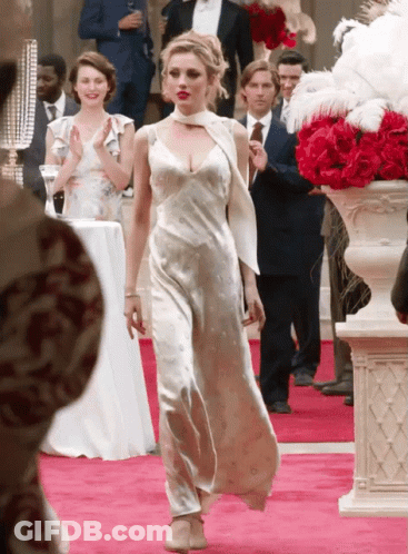 Woman In White Dress Walking Down Red Carpet GIF