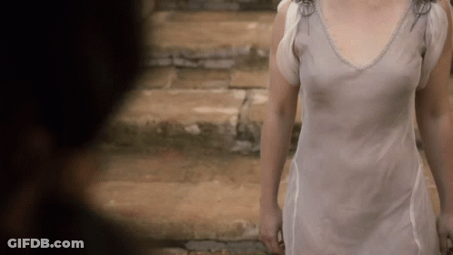Woman In White Dress Walking Down Stone Steps GIF