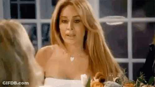 Woman In White Dress With Bouquet At Window GIF