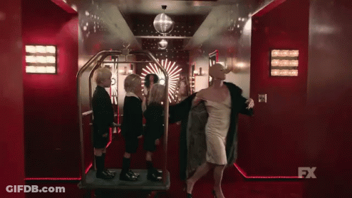 Woman In White Dress With Children And FX Sign GIF