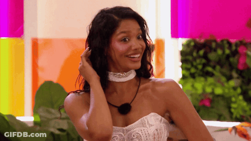 Woman In White Dress With Choker Smiling GIF
