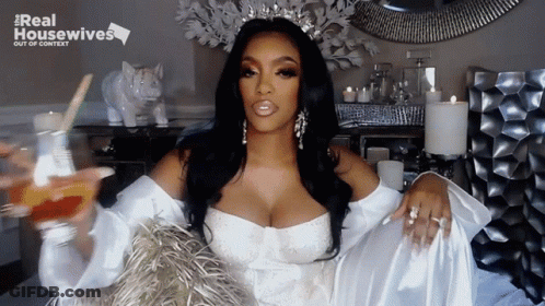 Woman In White Dress With Crown And Real Housewives Logo GIF