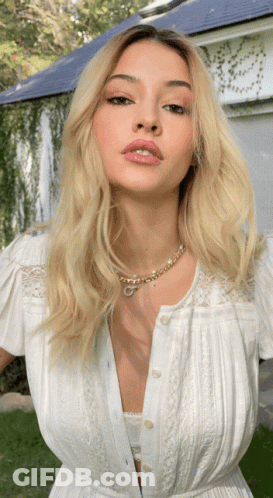 Woman In White Dress With G Necklace GIF