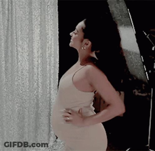 Woman In White Dress With Hands On Hips GIF