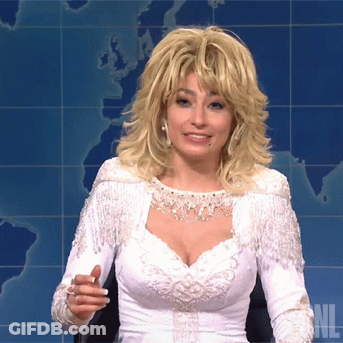Woman In White Fringe Dress On SNL GIF