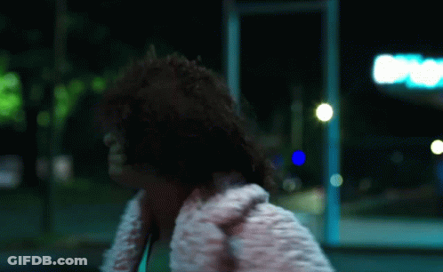 Woman In White Fur Coat Walking Down Street GIF