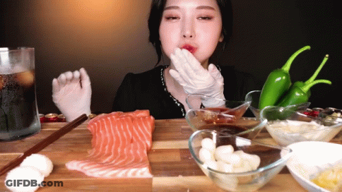 Woman In White Gloves Eating Salmon GIF