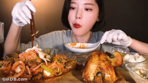 Woman In White Gloves Eating With Spoon GIF
