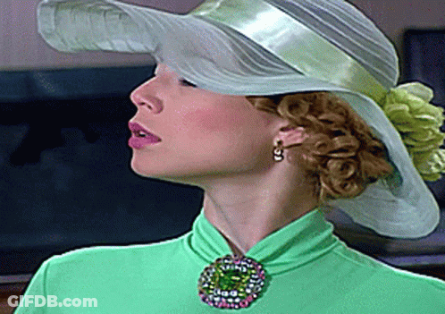 Woman In White Hat And Green Top GIF