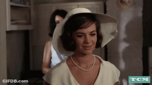 Woman In White Hat And Pearl Necklace GIF