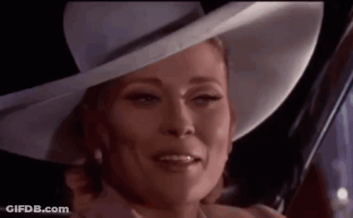 Woman In White Hat And Pearls Smiling GIF