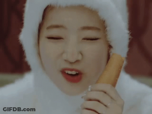 Woman In White Hat Eating Carrot Stick GIF