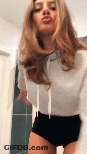 Woman In White Hoodie And Black Shorts Dancing GIF