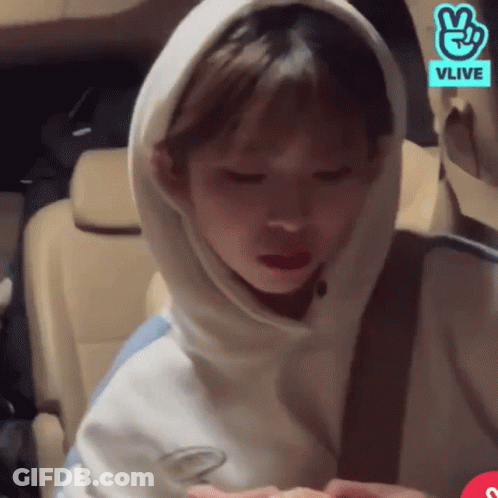 Woman In White Hoodie And Vlive Logo In Car GIF
