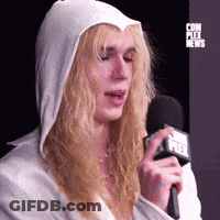 Woman In White Hoodie Holding Microphone With Fox News Logo GIF