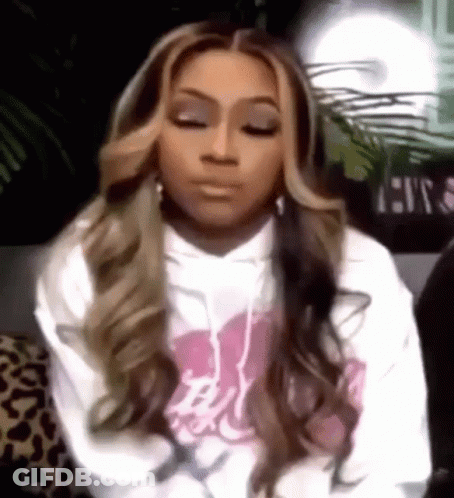 Woman In White Hoodie Sitting With Eyes Closed GIF