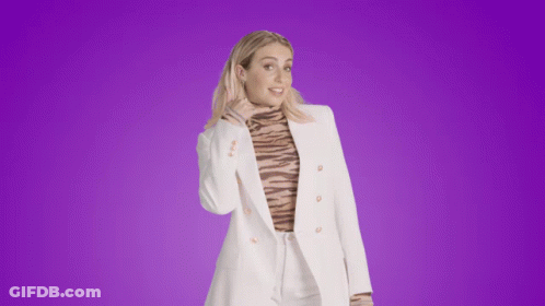 Woman In White Jacket And Tiger Print Turtleneck GIF