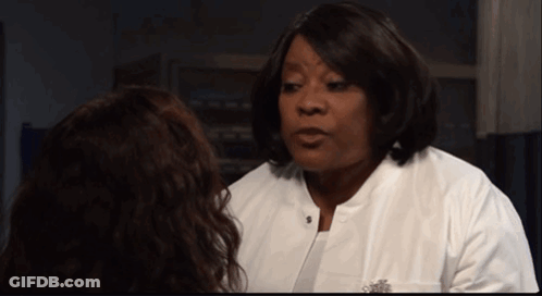 Woman In White Lab Coat Talking To Woman GIF