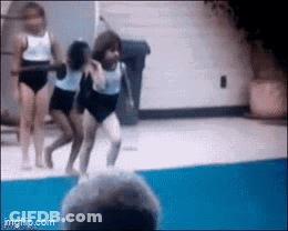 Woman In White Leotard Performing GIF