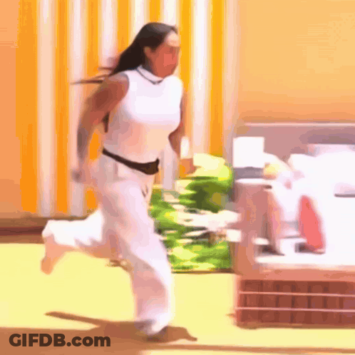 Woman In White Pants And Shirt Running GIF