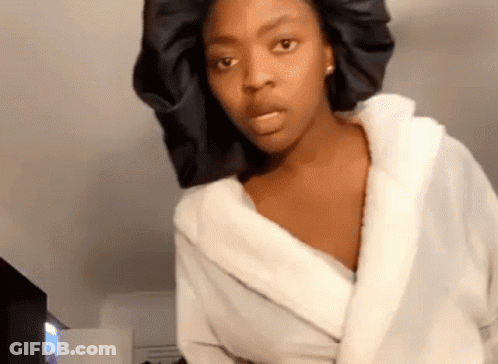 Woman In White Robe And Black Satin Bonnet GIF