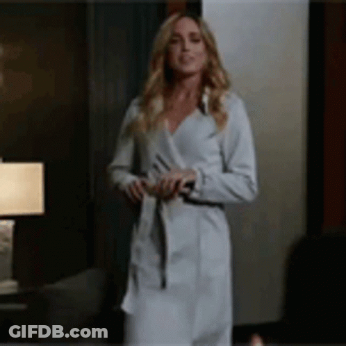 Woman In White Robe And Coat GIF